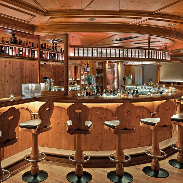 Rustic bar with wooden furniture and illuminated counter